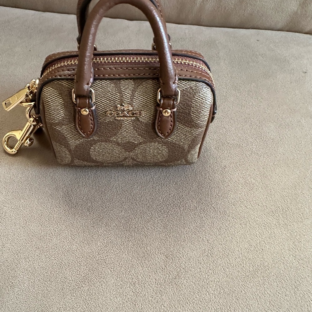 Coach Brown Bag Charm. Use for ear pods, etc. Rowan Collection